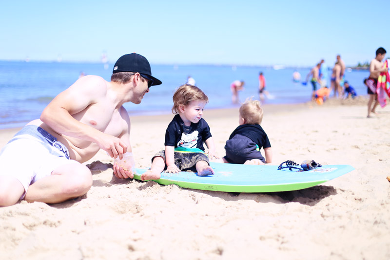 Abby's husband and babies enjoy the beach