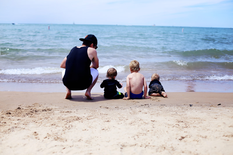 Abby's husband and sons line up at the water's edge.