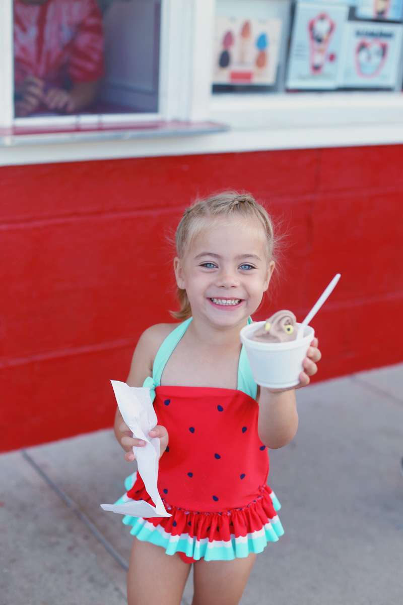 Savvy wears a watermelon swimsuit and shows off her chocolate ice cream.