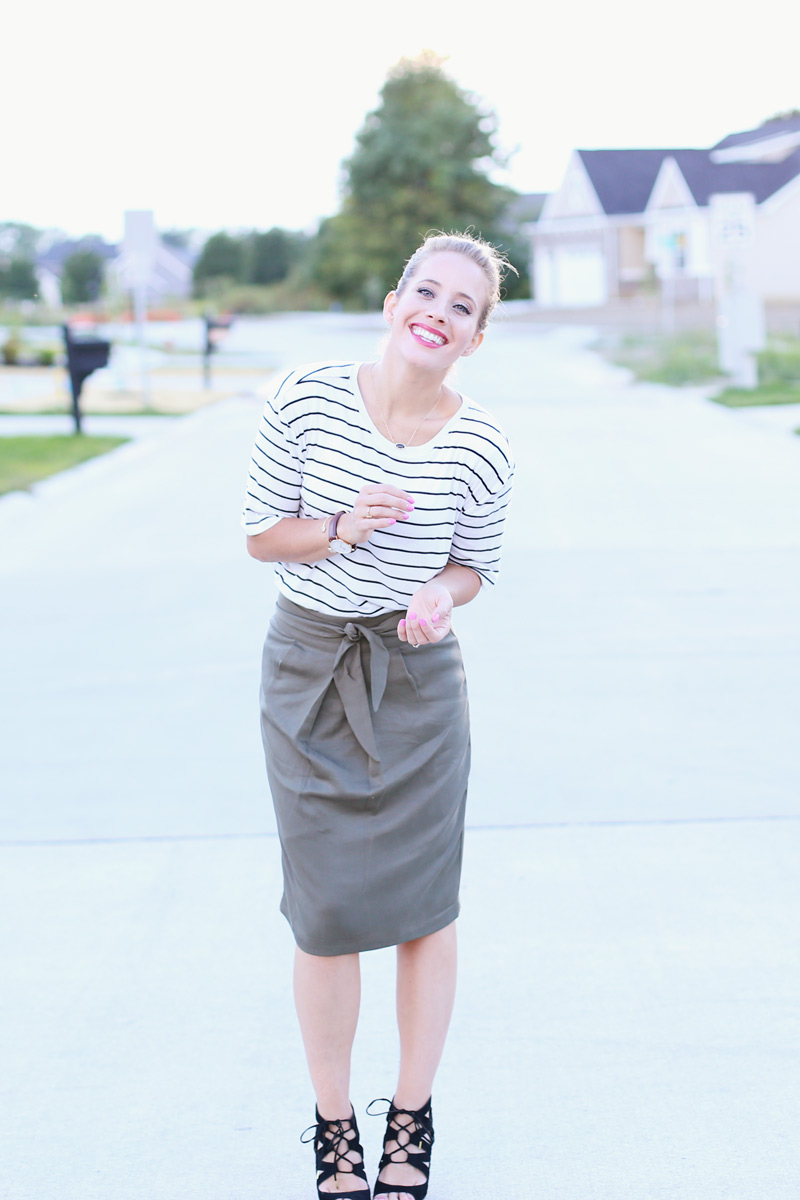 In the street, Abby appears to be clapping her hands. Sunday Style. Twist Me Pretty.