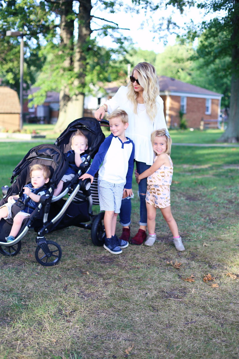 A mother and her four children, outside. You can tell she enjoys motherhood. Twist Me Pretty.