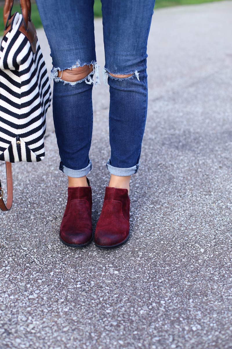 A woman's legs with her handbag and shoes. She enjoys motherhood. Twist Me Pretty.