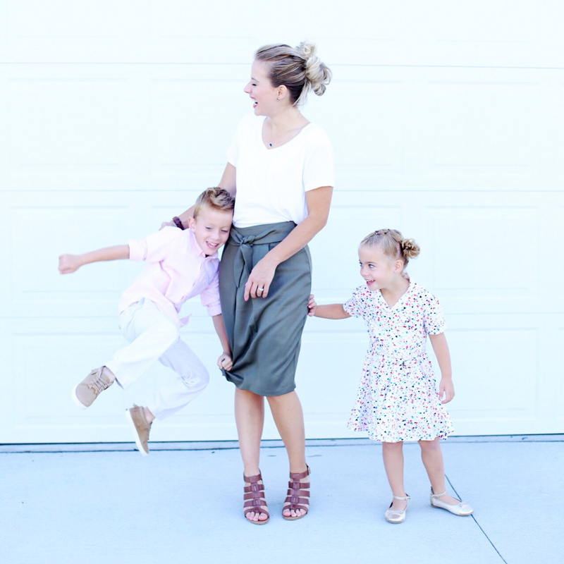 Twist me Pretty's Abby laughs as her children playfully grab her skirt. Sunday Style