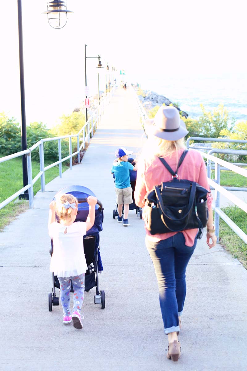 Family strolls down the pier. 
