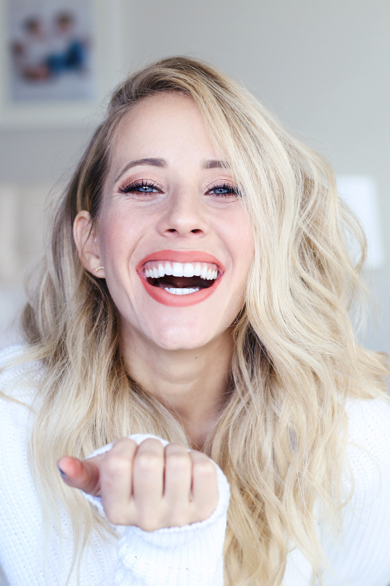 A blonde woman with copper eye-shadow laughs as she looks into the camera. Fall-inspired make-up tutorial.