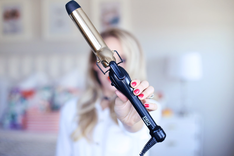 You can use a curling iron to create big loose waves - the perfect holiday hairstyle! Find out how at Twist Me Pretty.