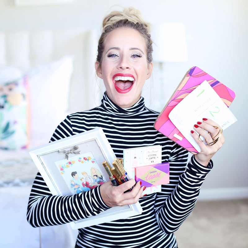 Twist Me Pretty's Abby grins as she holds her holiday favorites in her arms. 