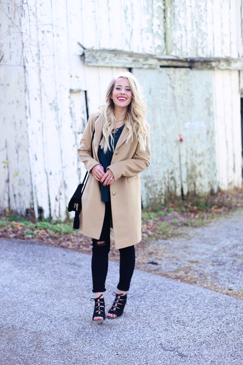 Twist Me Pretty's Abby looks fabulous as she stands outside an old buildling.