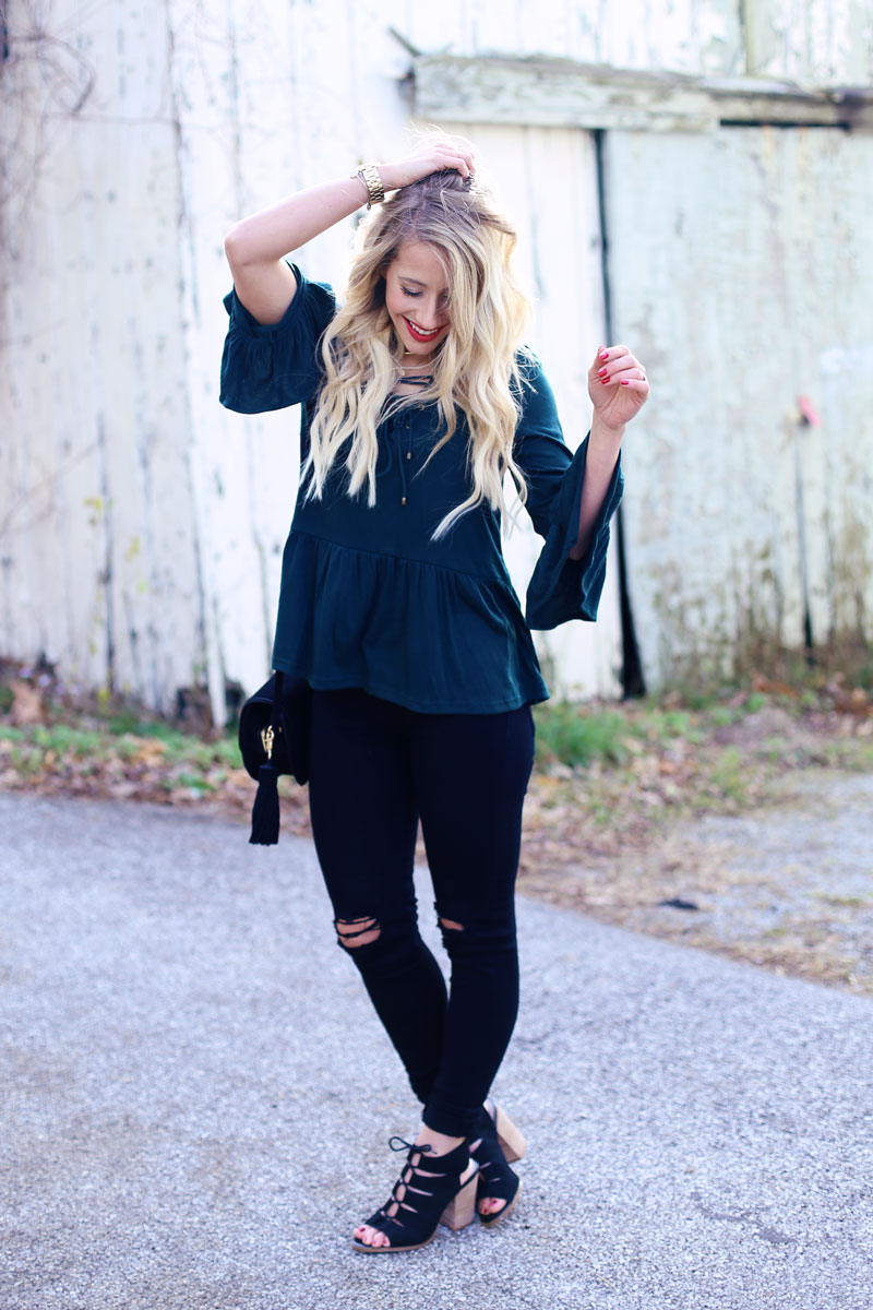 Bell sleeves inspire an everyday photo opp! Abby poses and shows off her outfit. Twist Me Pretty.