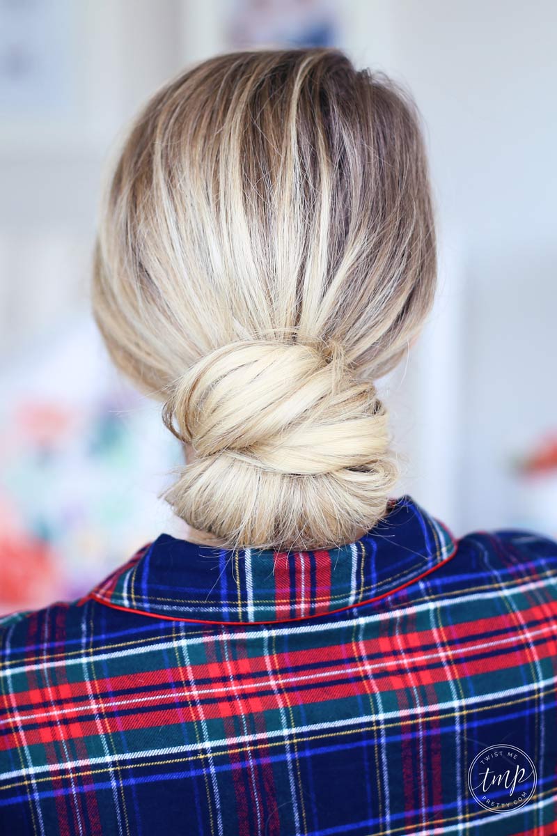 A neat low bun is the perfect Christmas morning hairstyle. Look fabulous this festive season with Twist Me Pretty.