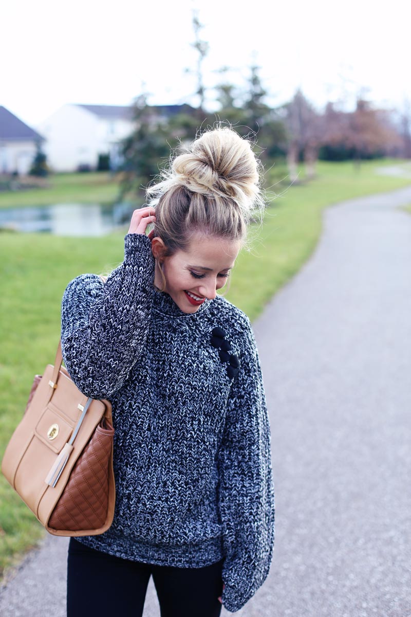 Big hair and big sweaters are a great pair.