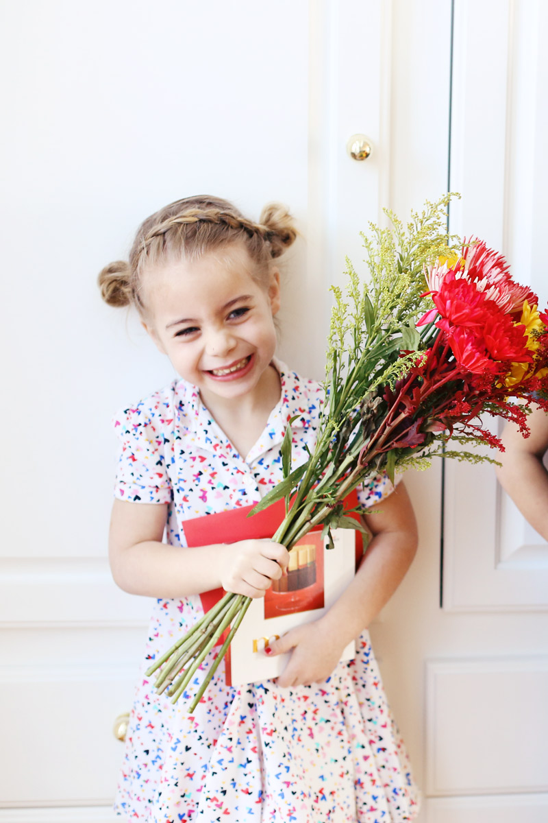 Savy is proud of the flowers and merci chocolates she'll give her teacher