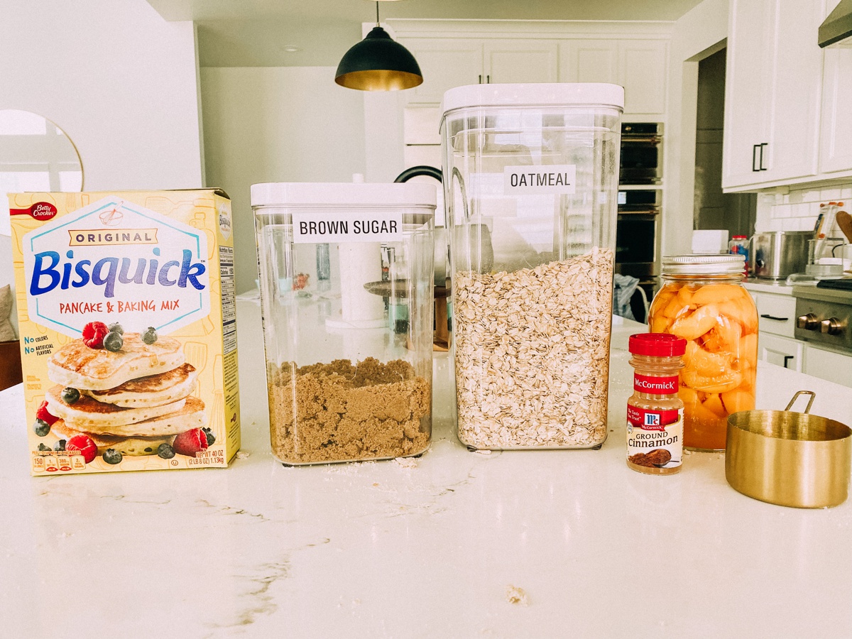 All the ingredients you need for easy peach cobbler with canned peaches. www.twistmepretty.com